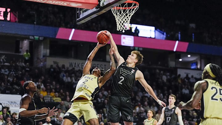 Jan 3, 2026; Winston-Salem, N.C.; Virginia Tech guard Jaden Schutt (2) blocks a shot by Wake Forest guard Juke Harris (2).