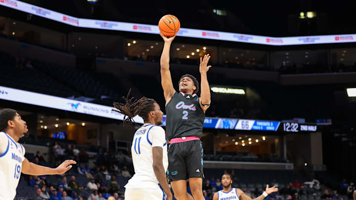 Jan 29, 2026; Memphis, Tennessee, USA; Florida Atlantic Owls guard Isaiah Elohim (2) shoots the ball against Memphis Tigers forward Aaron Bradshaw (11) during the second half at FedExForum. Mandatory Credit: Wesley Hale-Imagn Images