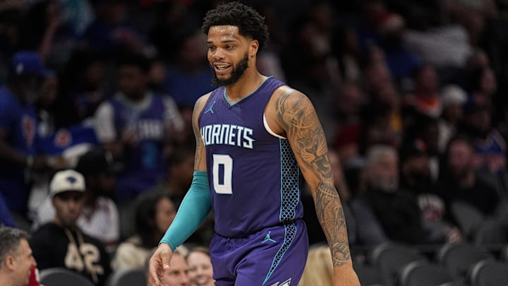 Mar 20, 2025; Charlotte, North Carolina, USA; Charlotte Hornets forward Miles Bridges (0) smiles as the Hornets take the lead against the New York Knicks during the second half at Spectrum Center. Mandatory Credit: Jim Dedmon-Imagn Images