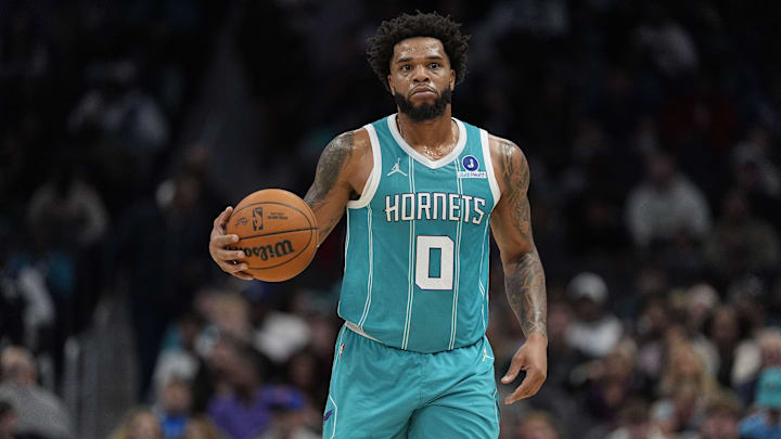 Nov 1, 2025; Charlotte, North Carolina, USA; Charlotte Hornets forward Miles Bridges (0) brings the ball up court against the Minnesota Timberwolves during the first quarter at Spectrum Center. Mandatory Credit: Jim Dedmon-Imagn Images