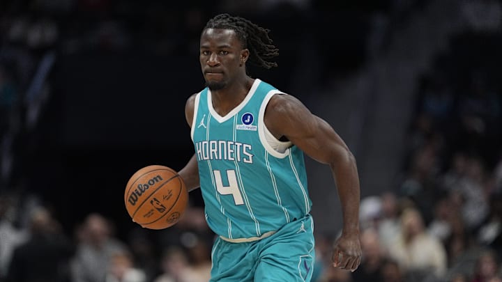 Nov 1, 2025; Charlotte, North Carolina, USA; Charlotte Hornets guard Sion James (4) brings the ball up court against the Minnesota Timberwolves during the first quarter at Spectrum Center. Mandatory Credit: Jim Dedmon-Imagn Images