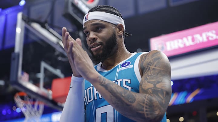 Jan 5, 2026; Oklahoma City, Oklahoma, USA; Charlotte Hornets forward Miles Bridges (0) claps at the end of the first half against the Oklahoma City Thunder at Paycom Center. Mandatory Credit: Alonzo Adams-Imagn Images