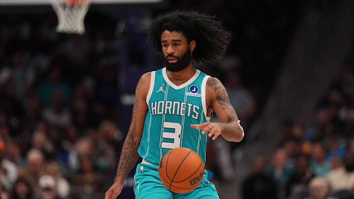 Charlotte Hornets guard Coby White (3) dribbles the ball against the Phoenix Suns 