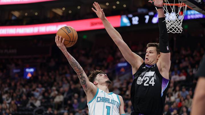 Charlotte Hornets guard LaMelo Ball (1) shoots against Utah Jazz center Walker Kessler Charlotte Hornets guard LaMelo Ball (1) shoots against Utah Jazz center Walker Kessler