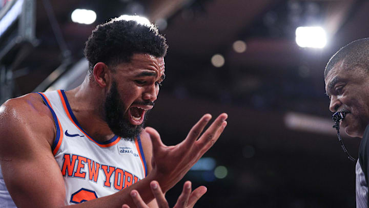 Jan 7, 2026; New York, New York, USA; New York Knicks center Karl-Anthony Towns (32) reacts in front of referee Tony Brothers (25) during the second half against the LA Clippers at Madison Square Garden. Mandatory Credit: Vincent Carchietta-Imagn Images