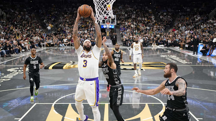 Nov 15, 2024; San Antonio, Texas, USA; Los Angeles Lakers forward Anthony Davis (3) drives to the basket past San Antonio Spurs forward Julian Champagnie (30) during the first half at Frost Bank Center. Mandatory Credit: Scott Wachter-Imagn Images