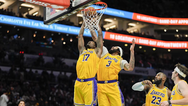 Jan 27, 2025; Charlotte, North Carolina, USA; Los Angeles Lakers forward Dorian Finney-Smith (17) and forward Anthony Davis (3) vie for the rebound against the Charlotte Hornets during the second half at the Spectrum Center. Mandatory Credit: Jim Dedmon-Imagn Images