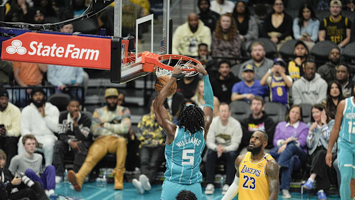 Jan 27, 2025; Charlotte, North Carolina, USA; Charlotte Hornets center Mark Williams (5) dunks the ball against Los Angeles Lakers forward LeBron James (23) during the second half at the Spectrum Center. Mandatory Credit: Jim Dedmon-Imagn Images Jan 27, 2025; Charlotte, North Carolina, USA; Charlotte Hornets center Mark Williams (5) dunks the ball against Los Angeles Lakers forward LeBron James (23) during the second half at the Spectrum Center. Mandatory Credit: Jim Dedmon-Imagn Images