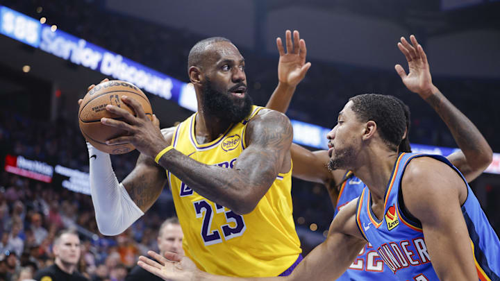 Apr 8, 2025; Oklahoma City, Oklahoma, USA; Oklahoma City Thunder guard Aaron Wiggins (21) defends Los Angeles Lakers forward LeBron James (23) during the second quarter at Paycom Center. Mandatory Credit: Alonzo Adams-Imagn Images Apr 8, 2025; Oklahoma City, Oklahoma, USA; Oklahoma City Thunder guard Aaron Wiggins (21) defends Los Angeles Lakers forward LeBron James (23) during the second quarter at Paycom Center. Mandatory Credit: Alonzo Adams-Imagn Images