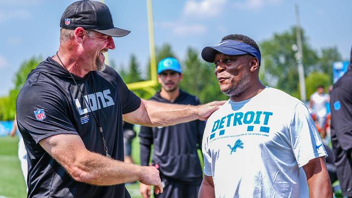 Detroit Lions head coach Dan Campbell jokes around with former Detroit Lions RB and hall of fame inductee Barry Sanders during the joint practice with the Miami Dolphins at the Lions headquarters and training facility in Allen Park, Thursday, Aug. 14 2025 Detroit Lions head coach Dan Campbell jokes around with former Detroit Lions RB and hall of fame inductee Barry Sanders during the joint practice with the Miami Dolphins at the Lions headquarters and training facility in Allen Park, Thursday, Aug. 14 2025