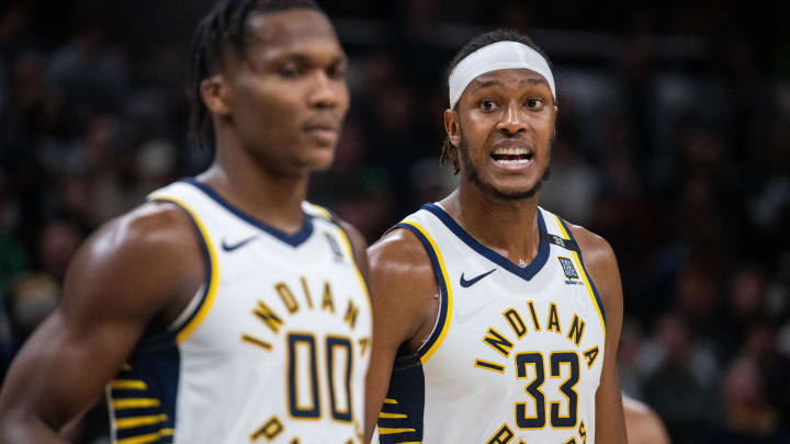 Jan 8, 2024; Indianapolis, Indiana, USA; Indiana Pacers center Myles Turner (33) talks to guard Bennedict Mathurin (00) after a timeout  in the second half against the Boston Celtics at Gainbridge Fieldhouse. Mandatory Credit: Trevor Ruszkowski-USA TODAY Sports