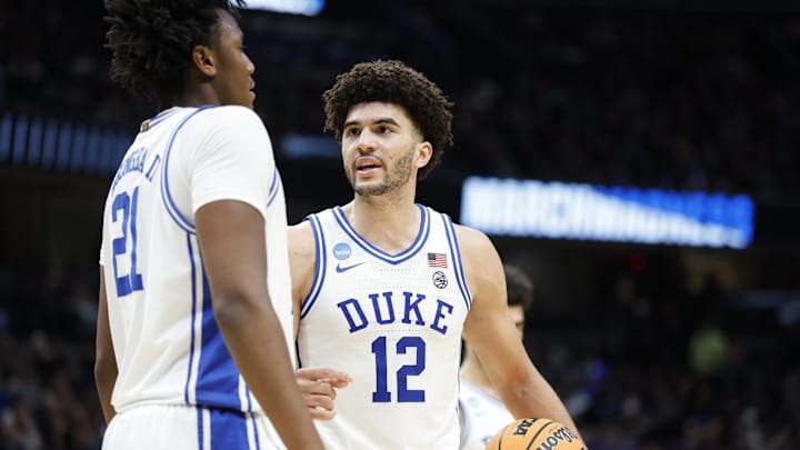Mar 29, 2026; Washington, DC, USA; Duke Blue Devils forward Cameron Boozer (12) talks to Blue Devils center Patrick Ngongba (21) during a stoppage in play against the UConn Huskies in the second half during an Elite Eight game of the East Regional of the men's 2026 NCAA Tournament at Capital One Arena. Mandatory Credit: Amber Searls-Imagn Images