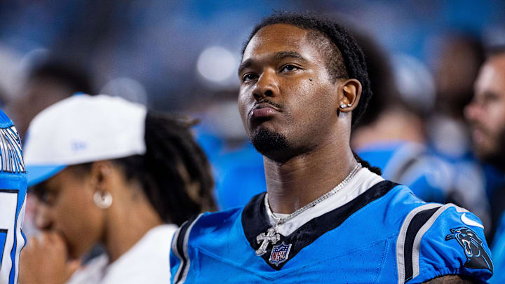 Aug 8, 2025; Charlotte, North Carolina, USA; Carolina Panthers running back Rico Dowdle (5) checks the scoreboard during the fourth quarter against the Cleveland Browns at Bank of America Stadium. Mandatory Credit: Scott Kinser-The USAToday Network via Imagn Images 