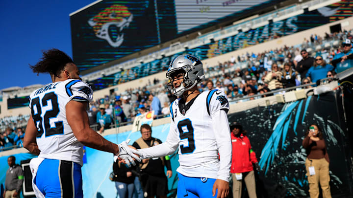 Carolina Panthers quarterback Bryce Young (9) greets tight end Tommy Tremble (82) before a regular season NFL football matchup Sunday, Dec. 31, 2023 at EverBank Stadium in Jacksonville, Fla. The Jacksonville Jaguars blanked the Carolina Panthers 26-0. [Corey Perrine/Florida Times-Union]