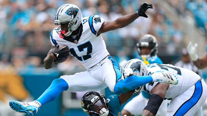 Carolina Panthers wide receiver Xavier Legette (17) leaps over Jacksonville Jaguars cornerback Jourdan Lewis (2) during the second quarter of an NFL football matchup at EverBank Stadium, Sunday, Sept. 7, 2025 in Jacksonville, Fla. [Corey Perrine/Florida Times-Union]