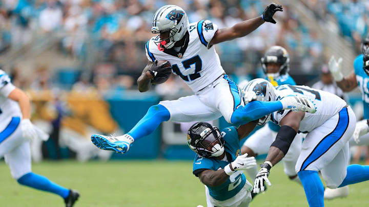Carolina Panthers wide receiver Xavier Legette (17) leaps over Jacksonville Jaguars cornerback Jourdan Lewis (2) during the second quarter of an NFL football matchup at EverBank Stadium, Sunday, Sept. 7, 2025 in Jacksonville, Fla. [Corey Perrine/Florida Times-Union]