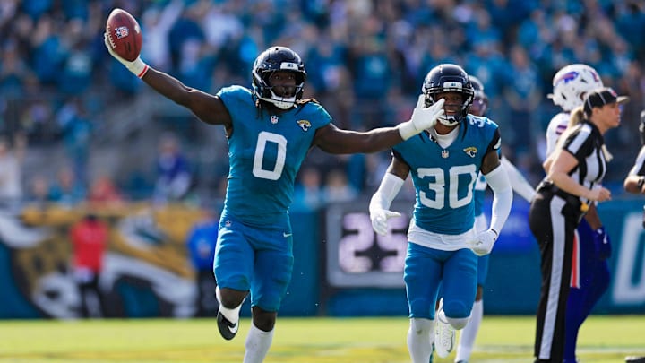 Jacksonville Jaguars linebacker Devin Lloyd (0) reacts to a fumble recovery next to cornerback Montaric Brown (30) during the second quarter of an NFL football AFC Wild Card playoff matchup, Sunday, Jan. 11, 2026, in Jacksonville, Fla. The Bills defeated the Jaguars 27-24. [Corey Perrine/Florida Times-Union]