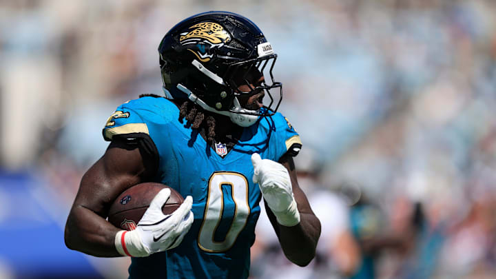 Jacksonville Jaguars linebacker Devin Lloyd (0) rushes for yards during the second quarter