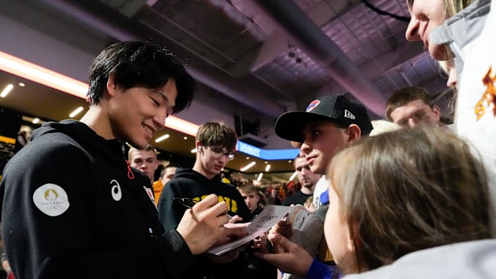 Masanosuke Ono signs autographs after the “FloWrestling Night in America” event Wednesday, Feb. 26, 2025 at Xtream Arena in Coralville, Iowa.