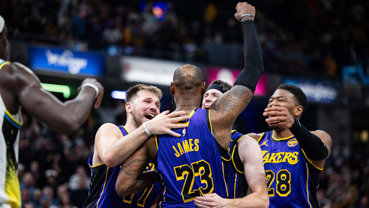 Mar 26, 2025; Indianapolis, Indiana, USA; Los Angeles Lakers forward LeBron James (23) celebrates his game winning shot against the Indiana Pacers with teammates at Gainbridge Fieldhouse. Mandatory Credit: Trevor Ruszkowski-Imagn Images Mar 26, 2025; Indianapolis, Indiana, USA; Los Angeles Lakers forward LeBron James (23) celebrates his game winning shot against the Indiana Pacers with teammates at Gainbridge Fieldhouse. Mandatory Credit: Trevor Ruszkowski-Imagn Images