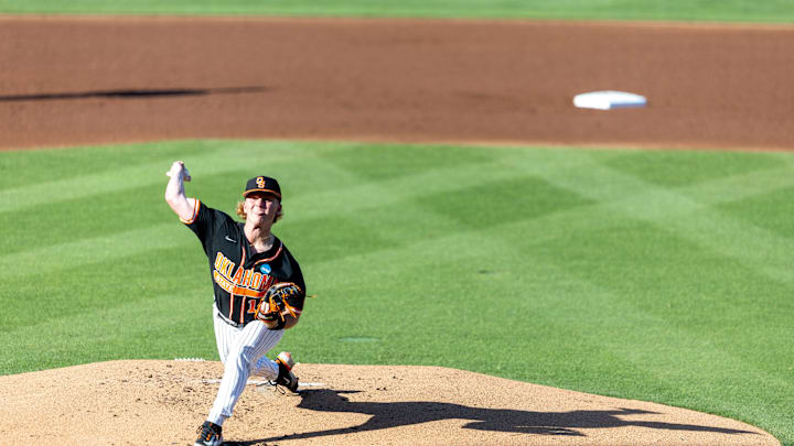 Jun 1, 2024; Stillwater, OK, USA; Oklahoma State pitcher Brian Holiday (14) pitches the ball during a NCAA regional baseball game against Florida at O'Brate Stadium. Mandatory Credit: Mitch Alcala-The Oklahoman