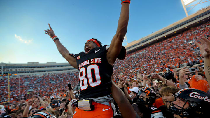 Oklahoma State's Brennan Presley (80) celebrates with teammates following a Bedlam college football game between the Oklahoma State University Cowboys (OSU) and the University of Oklahoma Sooners (OU) at Boone Pickens Stadium in Stillwater, Okla., Saturday, Nov. 4, 2023.