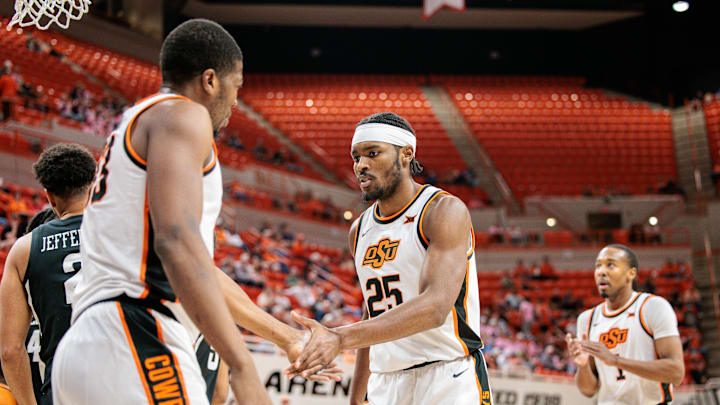 Feb 25, 2025; Stillwater, Oklahoma, USA; Oklahoma State Cowboys forward Robert Jennings II (25) slaps hands with Oklahoma State Cowboys forward Abou Ousmane (33) after a play during the first half against the Iowa State Cyclones at Gallagher-Iba Arena. Mandatory Credit: William Purnell-Imagn Images Feb 25, 2025; Stillwater, Oklahoma, USA; Oklahoma State Cowboys forward Robert Jennings II (25) slaps hands with Oklahoma State Cowboys forward Abou Ousmane (33) after a play during the first half against the Iowa State Cyclones at Gallagher-Iba Arena. Mandatory Credit: William Purnell-Imagn Images