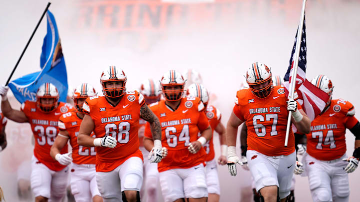 Oklahoma State runs on to the field before the college football game between the Oklahoma State Cowboys and South Dakota State Jackrabbits at Boone Pickens Stadium in Stillwater, Okla., Saturday, Aug., 31, 2024. Oklahoma State runs on to the field before the college football game between the Oklahoma State Cowboys and South Dakota State Jackrabbits at Boone Pickens Stadium in Stillwater, Okla., Saturday, Aug., 31, 2024.