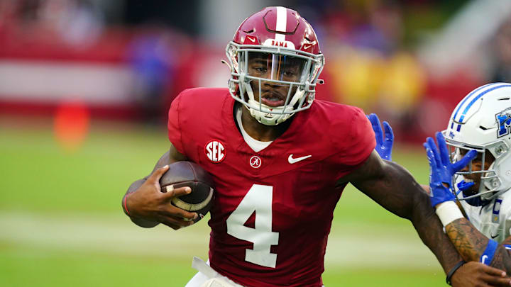 Sep 2, 2023; Tuscaloosa, Alabama, USA; Alabama Crimson Tide quarterback Jalen Milroe (4) carries the ball against the Middle Tennessee Blue Raiders for a touchdown during the first quarter at Bryant-Denny Stadium. Mandatory Credit: John David Mercer-Imagn Images