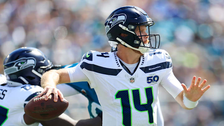 Seattle Seahawks quarterback Sam Darnold looks to pass during the second quarter of an NFL football matchup Seattle Seahawks quarterback Sam Darnold looks to pass during the second quarter of an NFL football matchup
