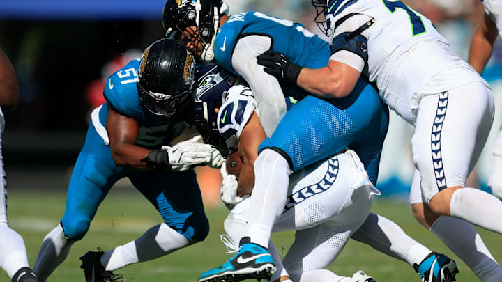 Jacksonville Jaguars defensive tackle Arik Armstead (91 tackles Seattle Seahawks running back Zach Charbonnet (26) in Week 7. Jacksonville Jaguars defensive tackle Arik Armstead (91 tackles Seattle Seahawks running back Zach Charbonnet (26) in Week 7.
