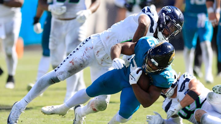 Jacksonville Jaguars running back Bhayshul Tuten (33) is tackled by Seattle Seahawks linebacker Ernest Jones (13) during the third quarter of an NFL football matchup, Sunday, Oct. 12, 2025, at EverBank Stadium in Jacksonville, Fla. The Seahawks defeated the Jaguars 20-12. Jacksonville Jaguars running back Bhayshul Tuten (33) is tackled by Seattle Seahawks linebacker Ernest Jones (13) during the third quarter of an NFL football matchup, Sunday, Oct. 12, 2025, at EverBank Stadium in Jacksonville, Fla. The Seahawks defeated the Jaguars 20-12.