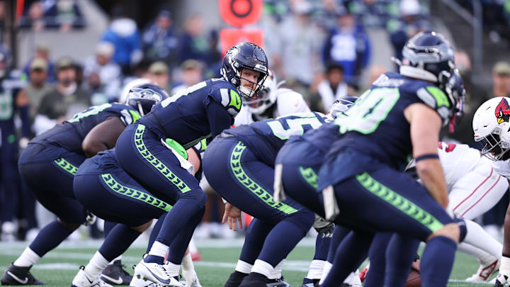 Nov 9, 2025; Seattle, Washington, USA;  Seattle Seahawks quarterback Sam Darnold (14) prepares to take a snap during the second quarter against the Arizona Cardinals at Lumen Field. Mandatory Credit: Kevin Ng-Imagn Images
