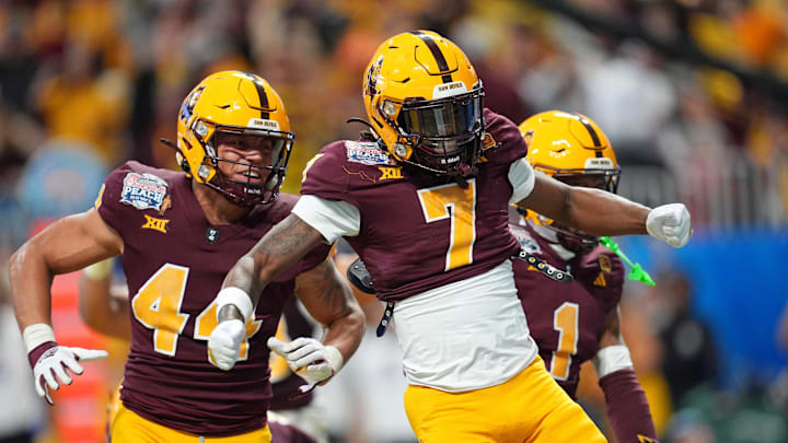 Jan 1, 2025; Atlanta, GA, USA; Arizona State Sun Devils linebacker Keyshaun Elliott (44) and defensive back Shamari Simmons (7) celebrate after a safety against the Texas Longhorns during the second half of the Peach Bowl at Mercedes-Benz Stadium. Mandatory Credit: Dale Zanine-Imagn Images