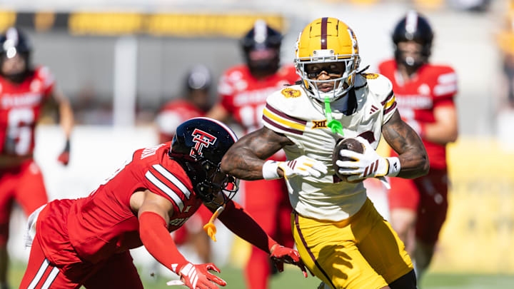 Oct 18, 2025; Tempe, Arizona, USA; Arizona State Sun Devils wide receiver Jaren Hamilton (16) runs the ball against diving Texas Tech Red Raiders safety Brenden Jordan in the first half at Mountain America Stadium. Mandatory Credit: Mark J. Rebilas-Imagn Images
