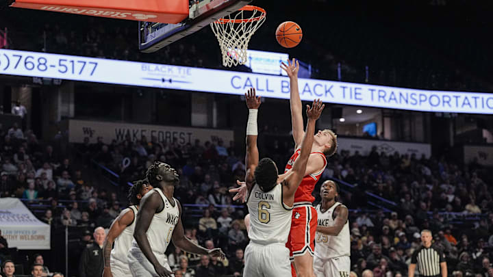Nov 28, 2025; Winston-Salem, North Carolina, USA; Northeastern Huskies forward Youri Fritz (7) goes to the basket against Wake Forest Demon Deacons guard Myles Colvin (6) during the second half at Lawrence Joel Veterans Memorial Coliseum. Mandatory Credit: Jim Dedmon-Imagn Images Nov 28, 2025; Winston-Salem, North Carolina, USA; Northeastern Huskies forward Youri Fritz (7) goes to the basket against Wake Forest Demon Deacons guard Myles Colvin (6) during the second half at Lawrence Joel Veterans Memorial Coliseum. Mandatory Credit: Jim Dedmon-Imagn Images