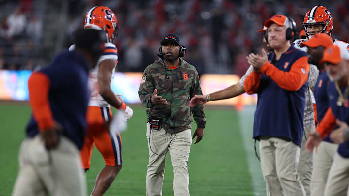Dec 27, 2024; San Diego, CA, USA; Syracuse Orange head coach Fran Brown congratulates his players after a scoring drive against the Washington State Cougars during the second half at Snapdragon Stadium. Dec 27, 2024; San Diego, CA, USA; Syracuse Orange head coach Fran Brown congratulates his players after a scoring drive against the Washington State Cougars during the second half at Snapdragon Stadium.