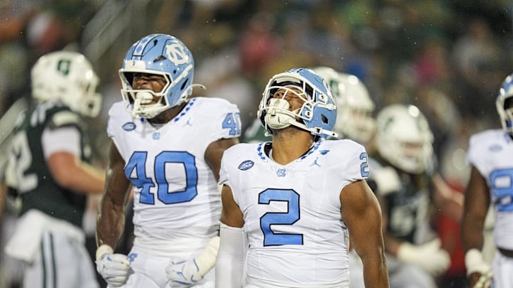 Sep 6, 2025; Charlotte, North Carolina, USA; North Carolina Tar Heels linebacker Andrew Simpson (2) celebtates his sack along with linebacker Tyler Thompson (40) during the second half against the Charlotte 49ers at Jerry Richardson Stadium. 