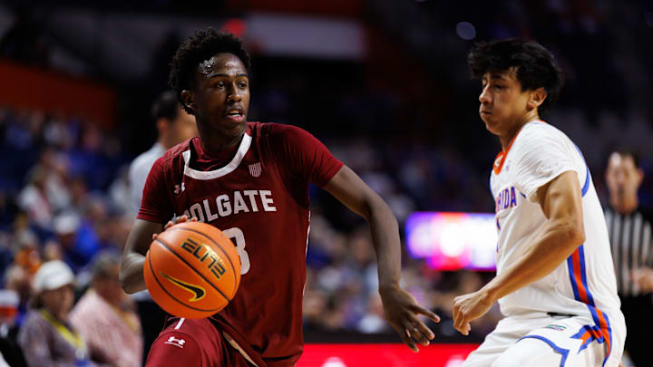 Dec 21, 2025; Gainesville, Florida, USA; Colgate Raiders guard Jalen Cox (3) drives to the basket while Florida Gators guard Xaivian Lee (1) defends during the first half at Exactech Arena at the Stephen C. O'Connell Center. Mandatory Credit: Matt Pendleton-Imagn Images
