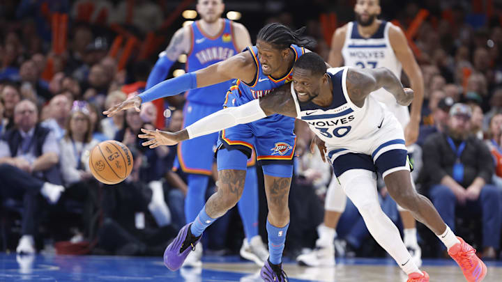 Dec 31, 2024; Oklahoma City, Oklahoma, USA; Oklahoma City Thunder forward Jalen Williams (8) steals the ball away from Minnesota Timberwolves forward Julius Randle (30) during the second half at Paycom Center. Mandatory Credit: Alonzo Adams-Imagn Images