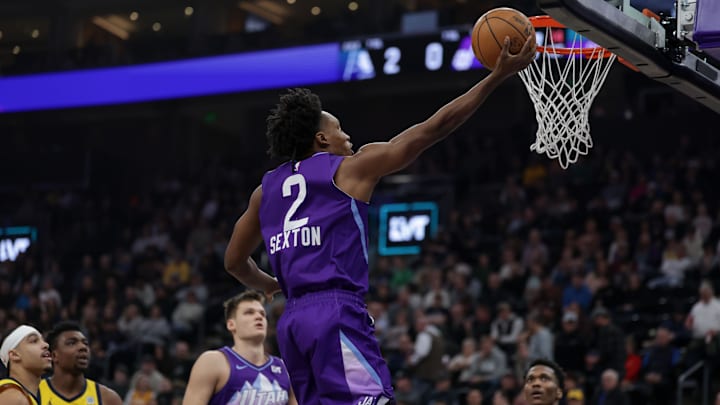 Feb 3, 2025; Salt Lake City, Utah, USA;  Utah Jazz guard Collin Sexton (2) lays the ball up to the basket during the first quarter against the Indiana Pacers at Delta Center. Mandatory Credit: Chris Nicoll-Imagn Images
