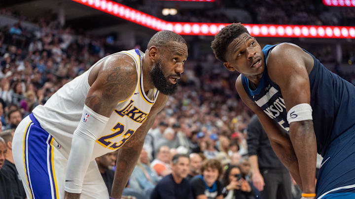 Apr 27, 2025; Minneapolis, Minnesota, USA; Minnesota Timberwolves guard Anthony Edwards (5) guards Los Angeles Lakers forward LeBron James (23) in the second quarter during game four of first round for the 2025 NBA Playoffs at Target Center. Mandatory Credit: Matt Blewett-Imagn Images