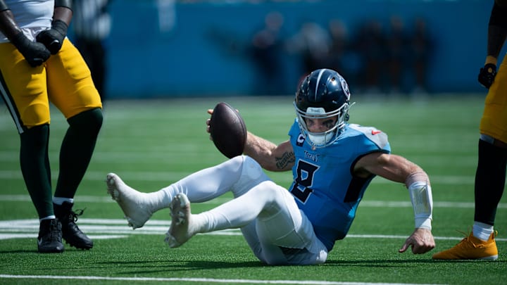 Tennessee Titans quarterback Will Levis (8) picks himself up short of the first down on a fourth-down play after being tackled by Green Bay Packers linebacker Quay Walker (7) in the third quarter during their game at Nissan Stadium in Nashville, Tenn., Sunday, Sept. 22, 2024.