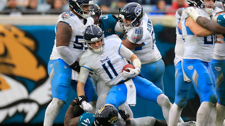 Jacksonville Jaguars defensive end Josh Hines-Allen (41) sacks Tennessee Titans quarterback Mason Rudolph (11) during the third quarter Sunday, Dec. 29, 2024 at EverBank Stadium in Jacksonville, Fla. The Jaguars held off the Titans 20-13. [Corey Perrine/Florida Times-Union]