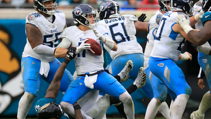 Tennessee Titans quarterback Mason Rudolph (11) is sacked by Jacksonville Jaguars defensive end Josh Hines-Allen (41) during the third quarter Sunday, Dec. 29, 2024 at EverBank Stadium in Jacksonville, Fla. The Jaguars held off the Titans 20-13. [Corey Perrine/Florida Times-Union]