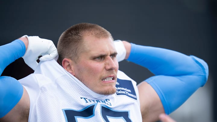 Tennessee Titans outside linebacker Cody Barton removes his jersey after OTAs.