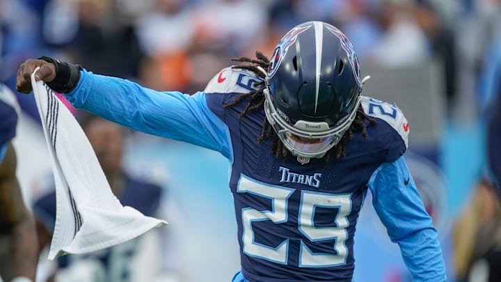 Jarvis Brownlee Jr. hits the field before the Titans play the Bengals.