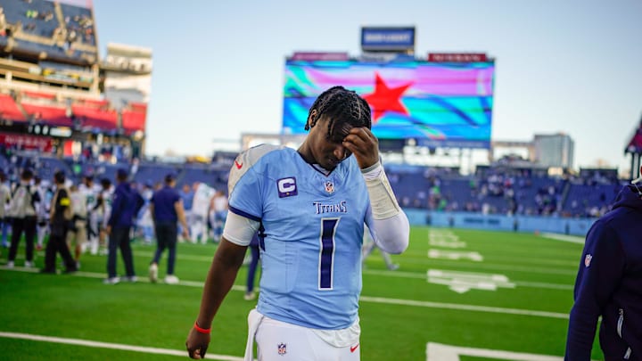 Nov 23, 2025; Nashville, Tennessee, USA; Tennessee Titans quarterback Cam Ward (1) exits the field after the game against the Seattle Seahawks  at Nissan Stadium. Mandatory Credit: Andrew Nelles-USA TODAY Network via Imagn Images