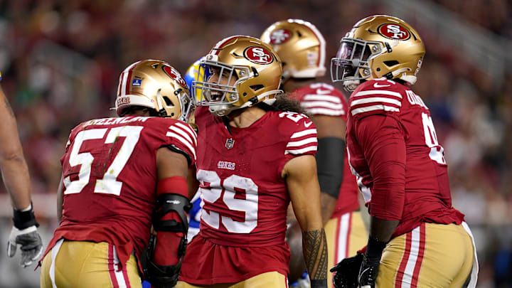 Dec 12, 2024; Santa Clara, California, USA; San Francisco 49ers linebacker Dre Greenlaw (57) is congratulated by safety Talanoa Hufanga (29) after making a tackle against the Los Angeles Rams in the first quarter at Levi's Stadium. Mandatory Credit: Cary Edmondson-Imagn Images
