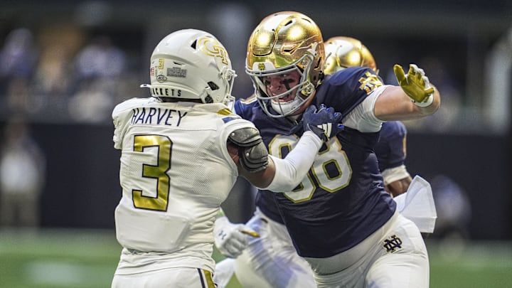 Oct 19, 2024; Atlanta, Georgia, USA; Notre Dame Fighting Irish tight end Mitchell Evans (88) blocks against Georgia Tech Yellow Jackets defensive back Ahmari Harvey (3) at Mercedes-Benz Stadium. Mandatory Credit: Dale Zanine-Imagn Images